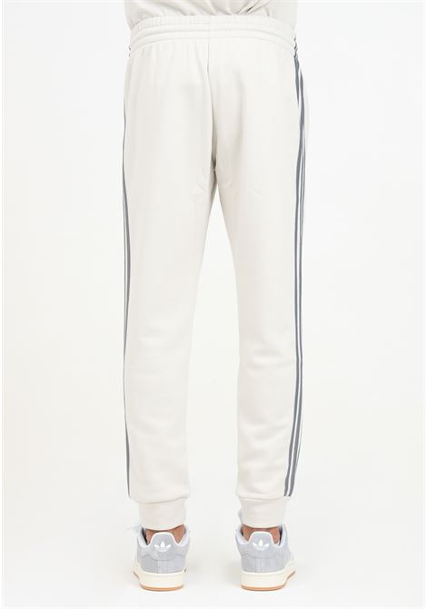 Pantalone sportivo Essentials French Terry Tapered Cuff 3-Stripes beige da uomo ADIDAS PERFORMANCE | JG5952.